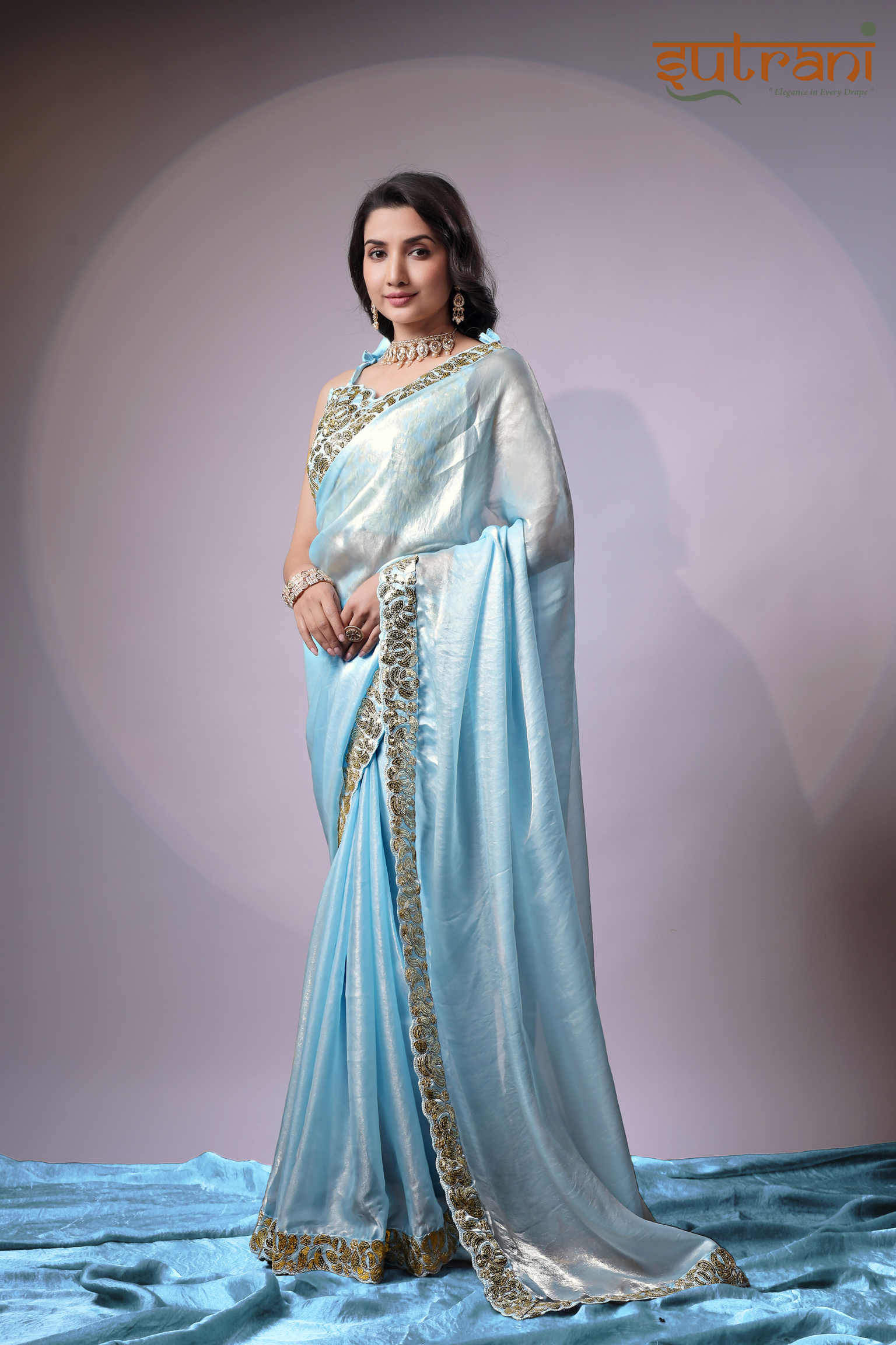Sutrani Timeless Sky Blue Satin Saree with Elegant Gold Finish
