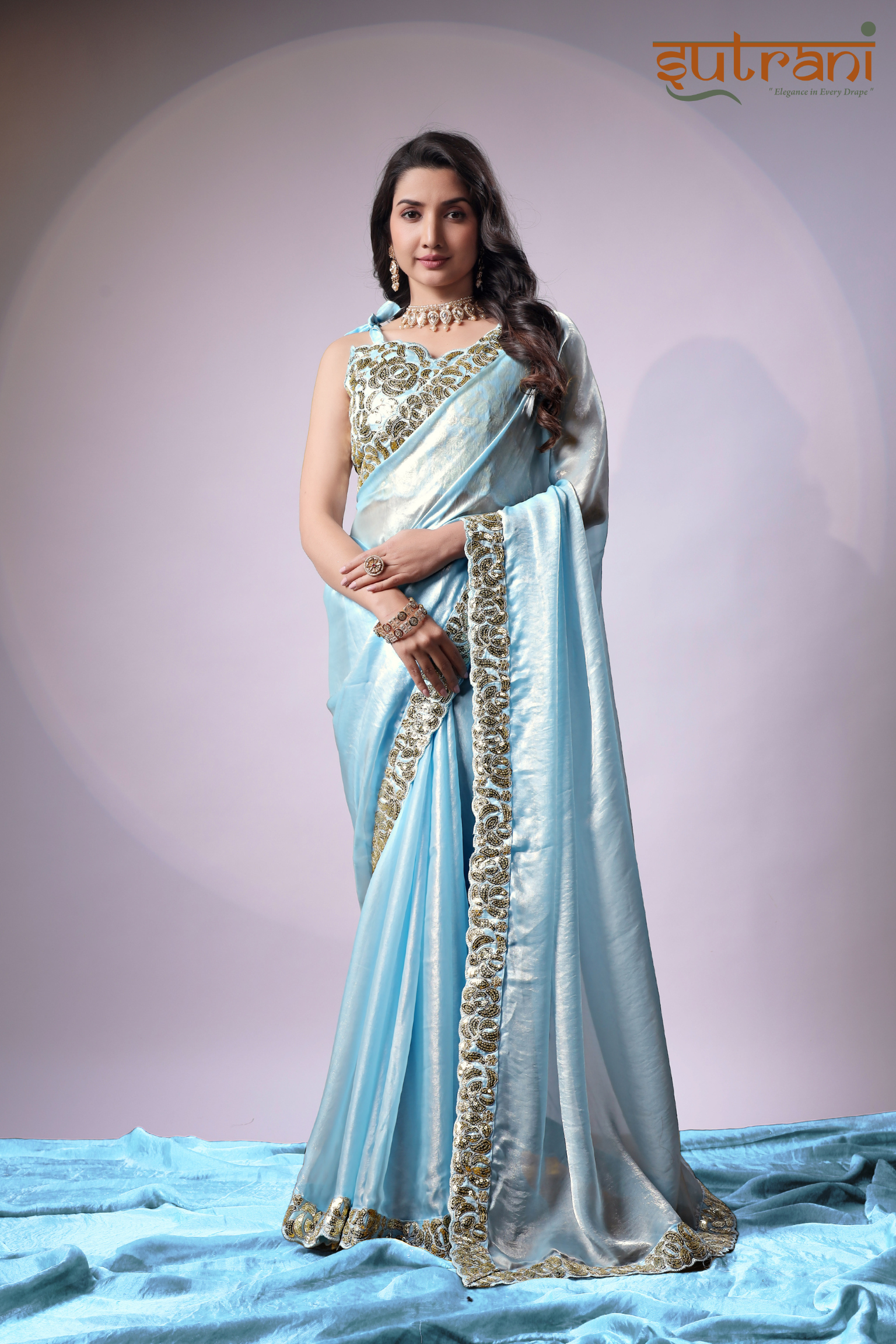 Sutrani Timeless Sky Blue Satin Saree with Elegant Gold Finish