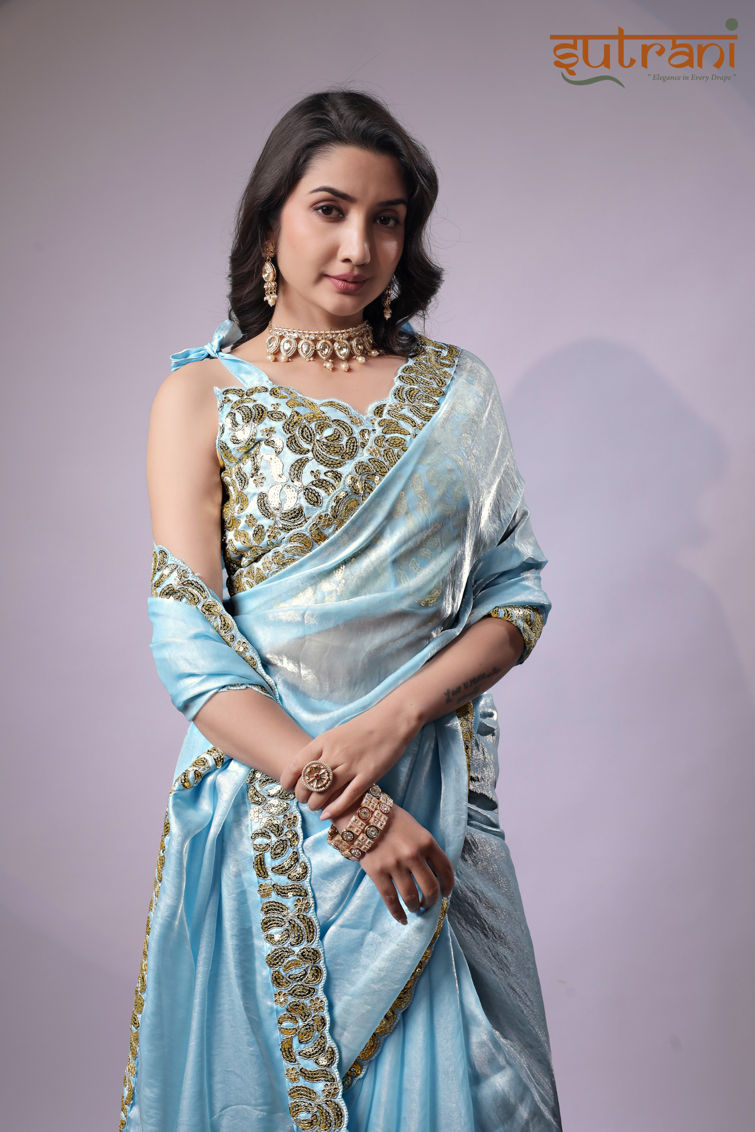 Sutrani Timeless Sky Blue Satin Saree with Elegant Gold Finish